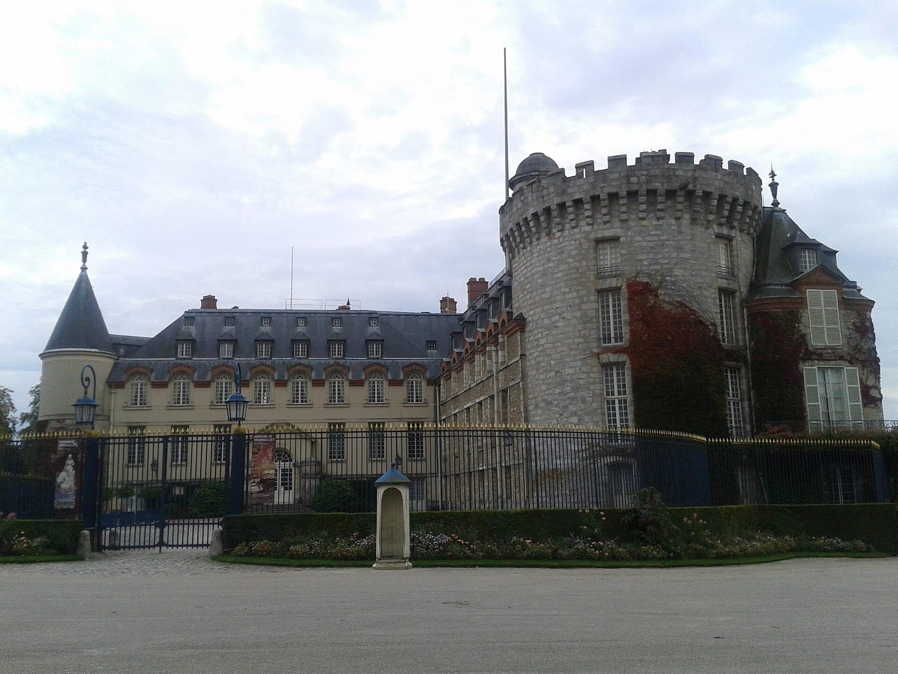 Railed gate and the large round medieval tower.
