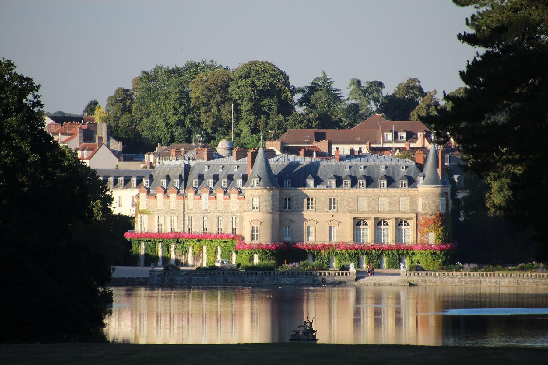 The château across the water, reflected in the canal in evening light.
