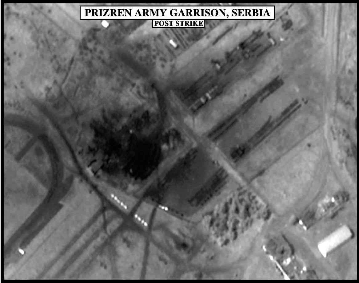 Black-and-white aerial image of a barracks compound with strike marks.
