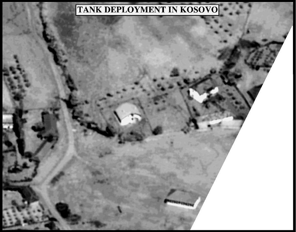 Black-and-white aerial view of houses and yards captioned 'Tank deployment in Kosovo'.